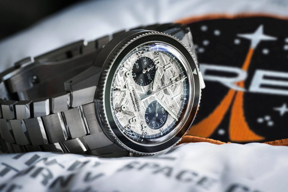 Chronoscope DEDALE WP-01 SIdus watch on an astronaut's jacket, space-themed look - meteorite dial chronograph